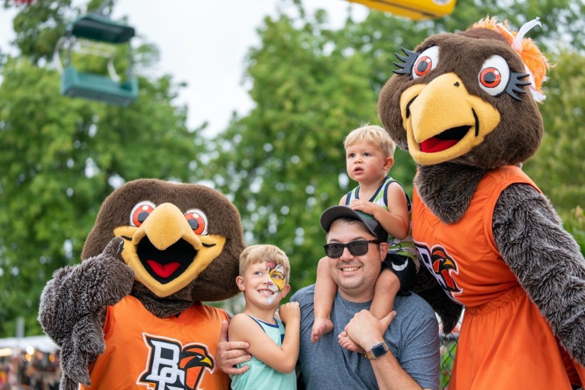 Freddie and Frieda Falcon pose with fans at the Ohio State Fair midway