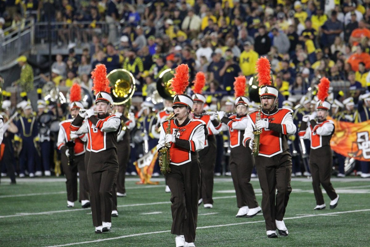 Members of the Falcon Marching Band take to the field in Michigan Stadium Saturday, Sept. 16, 2023