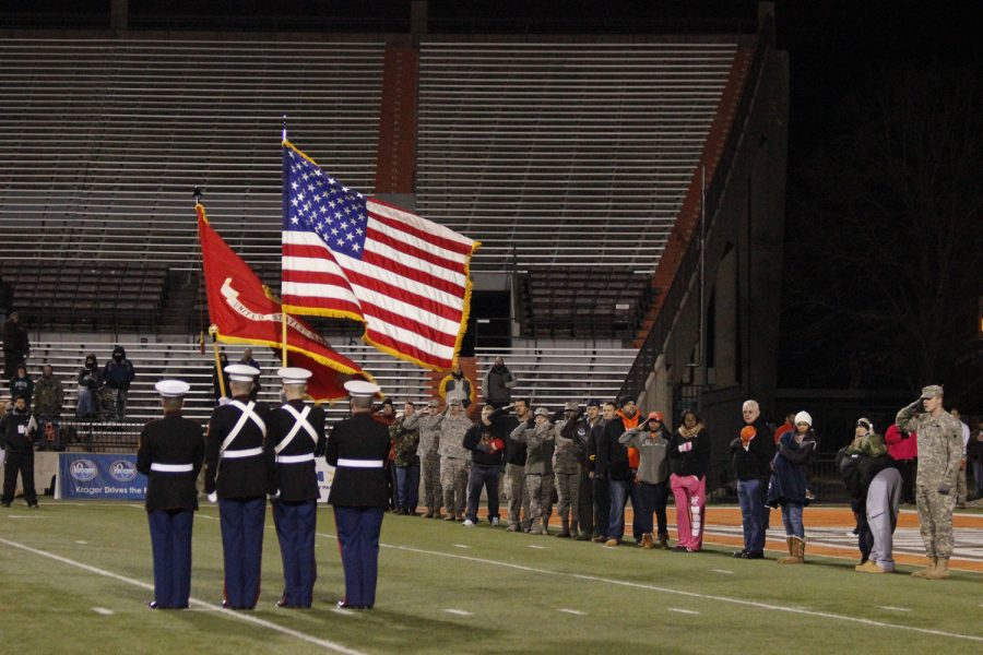 Veterans line up in the end zone before Tuesday night&#8217;s game. They were honored with the &#8220;Star-Spangled Banner&#8221; and a display of colors for their service.