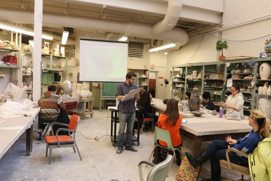 Zimra Beiner, ceramics instructor, teaches a group of students during a ceramics class on Tuesday afternoon.