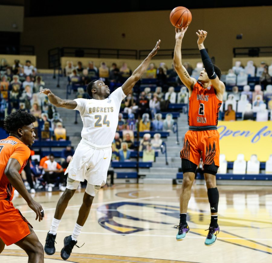 BGSUs Josiah Fulcher shoots over Toledos Keshaun Sanders in the Falcons 88-81 victory over the Rockets at Savage Arena on Saturday, Feb. 13, 2021. 