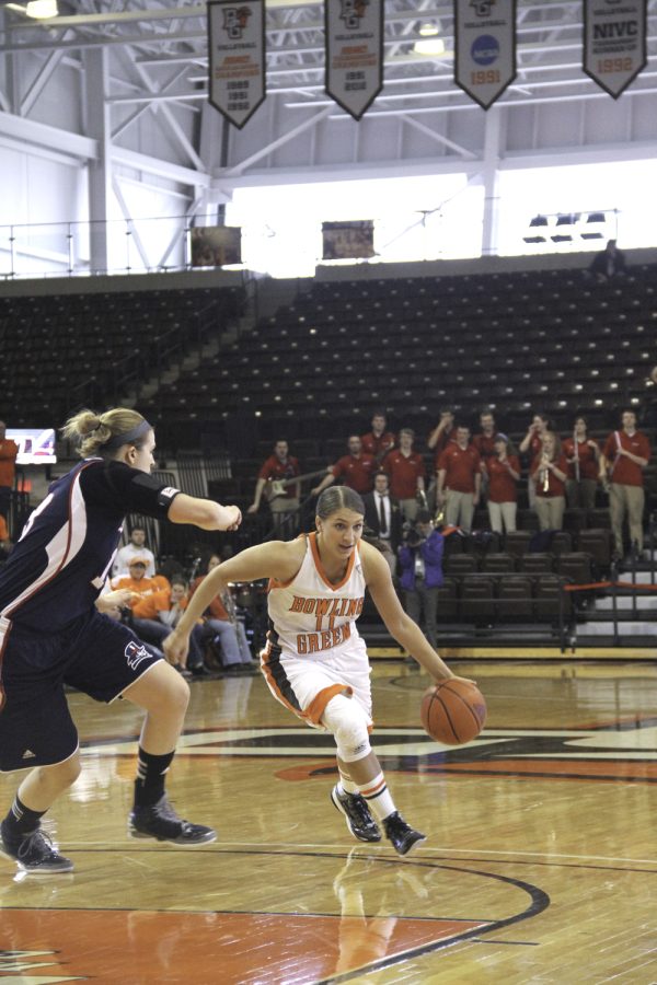 Jillian Halfhill dribbles around a Duquesne defender in the WNIT second round game hosted at the Stroh on Saturday.