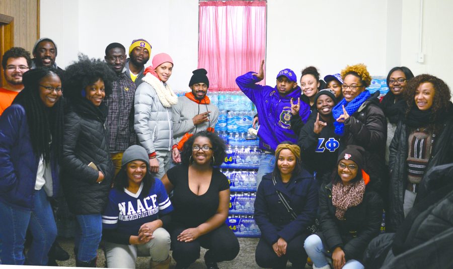 A group of University students bringing water to Flint, Michigan
