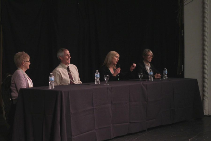 Four panelists speak on the topic of human trafficking and risk prevention Thursday evening.