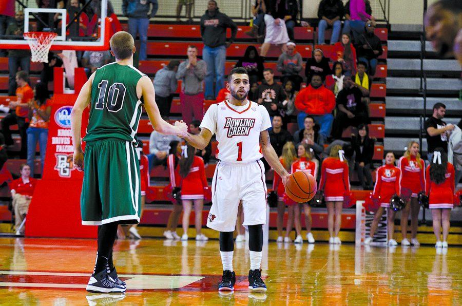 Jordon Crawford, BG guard, directs traffic as he is guarded by Lake Erie’s Andy Bosley during the Falcons’ 63-53 victory against the Storm earlier this season at the Stroh Center.