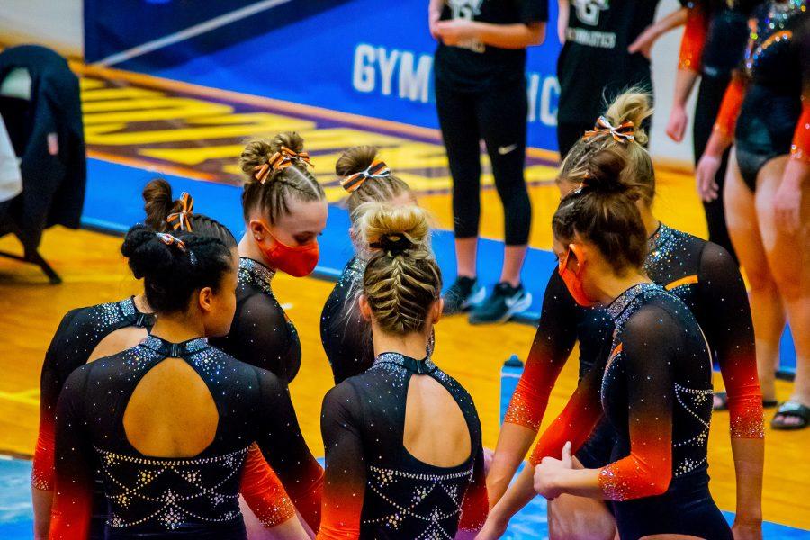 The BGSU gymnastics team huddles up during their 196.050-193.950 home loss to Kent State on Friday, March 12, 2021.