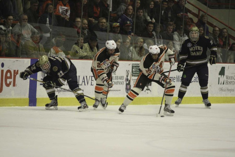 BG+Players+chase+the+puck+against+nationally+ranked+Notre+Dame%2C+a+game+in+which+they+won+4-2.+The+Falcons+face+the+Lake+Superior+State+Lakers+Friday+and+Saturday.