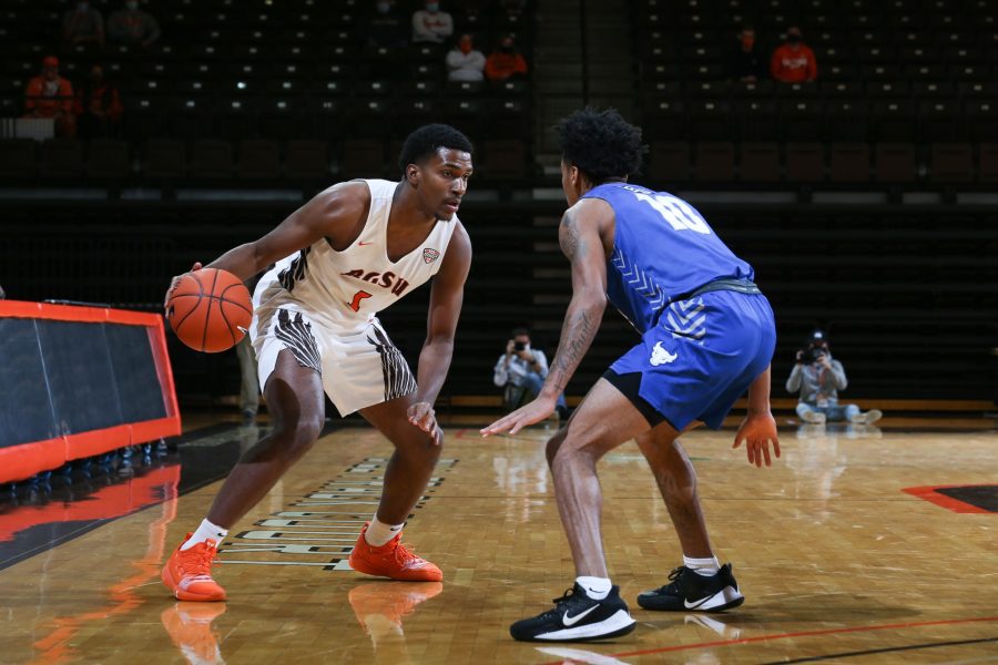 Justin Turner (1) is defended by Ronaldo Segu (10) in BGSU Mens Basketballs 86-78 win over Buffalo on Sunday, Dec. 6, 2020 inside the Stroh Center. Turner finished with a game high 33-points to lead the Falcons to victory.