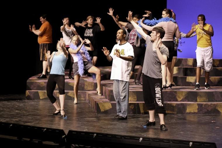 cast members for the musical “Chicago” practice before their performance this past spring. Ticket prices for this year will be $1.75 if students order online.