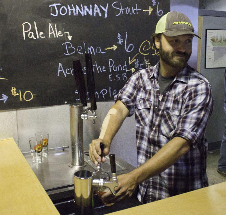 The owner of Bowling Green Beer Works, Justin Marx, pours a pint of beer Friday, Sept. 11.