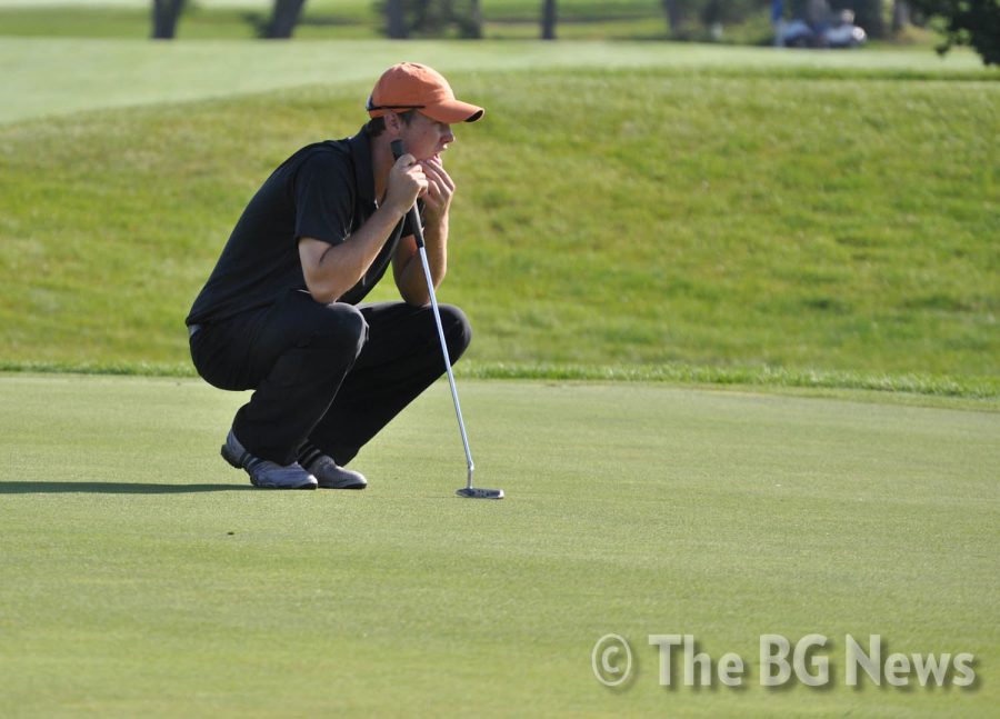 Drew+Preston%2C+BG+golfer%2C+looks+over+a+putt+on+the+eighth+green%0Aof+Stone+Ridge+Golf+Club.