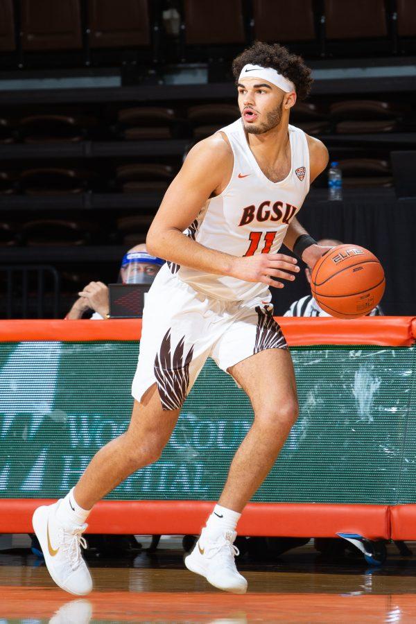 Trey Diggs dribbles the ball in BGSU Mens Basketballs game against South Carolina State on Saturday, Nov. 28.