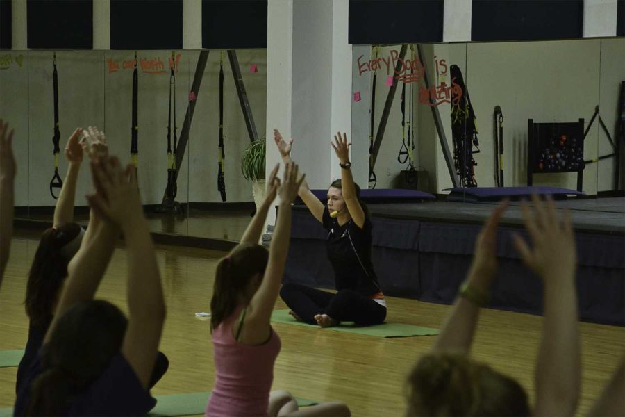 Kristin Baumgardner instructs a yoga class Tuesday night in the Student Recreation Center as part of National Eating Disorders Week.