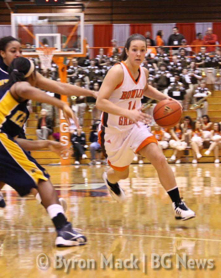 Jessica Slagle, BG guard, runs past a Kent State defender in a
game last season. Slagle and the Falcons play thier first home game
of the season Thursday.