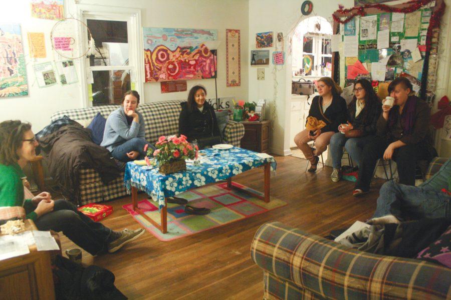Students talk about exam week and other topics at a listening circle event at The Common Good, a living experiment house on Crim Street.
