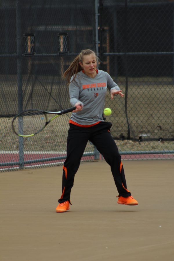 Brittany Plaszewski gets set and returns a ball in a match earlier this season.