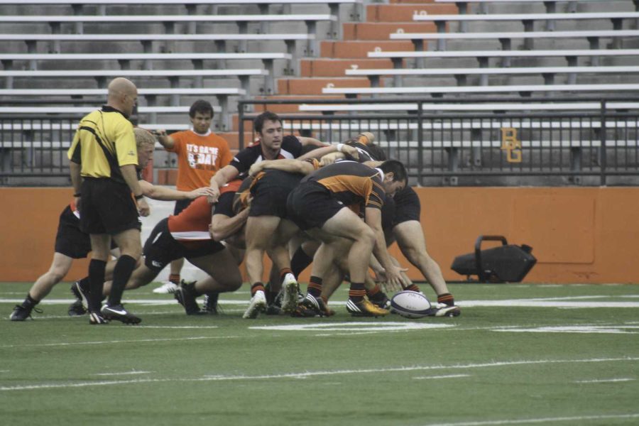 Grasping for the ball a scrum of BG players compete in a game this past season.
