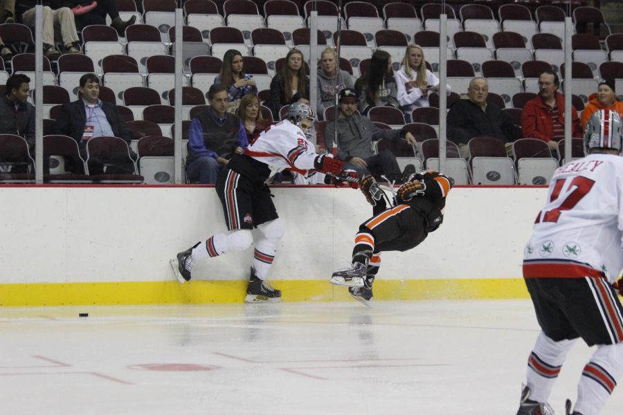 Ohio State defender Justin DaSilva makes a big hit on one of the BG players in their 5-3 home win over the Falcons Tuesday night.