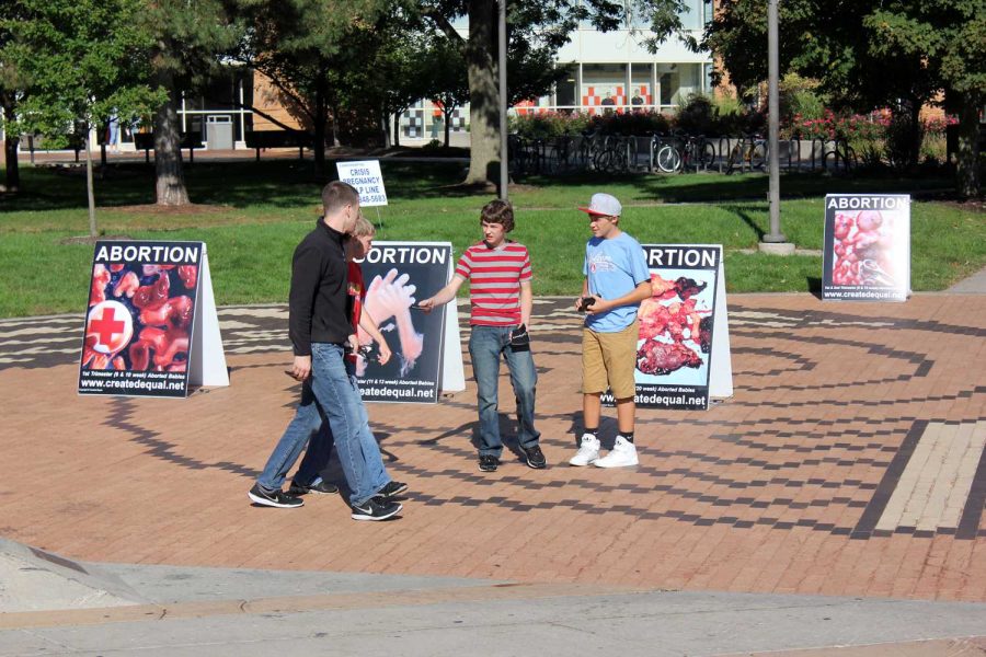 Members of Created Equal try to inform students about abortion on Tuesday.