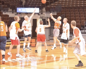 Members of the local media compete in the first media game at the Stroh Center on Tuesday afternoon.