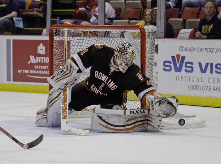 Andrew Hammond, BG goalie, reaches for a puck during the Falcons 3-2, double overtime loss to Michigan in the CCHA semifinals last season.