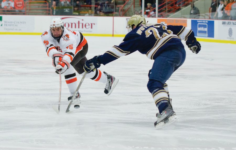 Ted PLESTCH, BG forward, cuts inside an Ohio State defender to get to the puck.