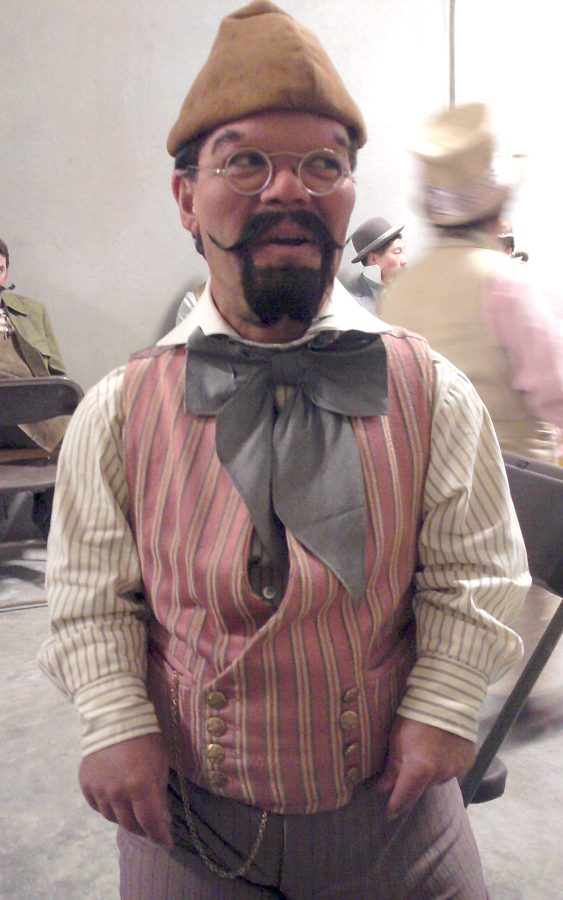 Dan Cota gets dressed in costume and makeup to play one of the dancing munchkins in the new Disney film, “Oz, the Great and Powerful.”