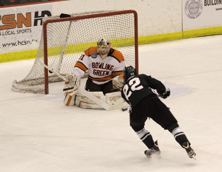 Andrew Hammond stops a shot from a Michigan State forward in a game earlier this season.