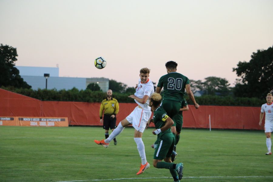 Achille Robin heads a ball towards the goal against Cleveland State.