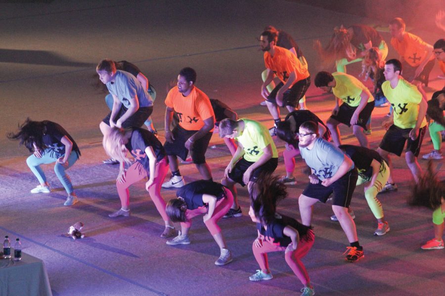 Alpha xi Delta and Sigma Phi Epsilon show off their dance moves at Greek Sing at the Stroh Center.