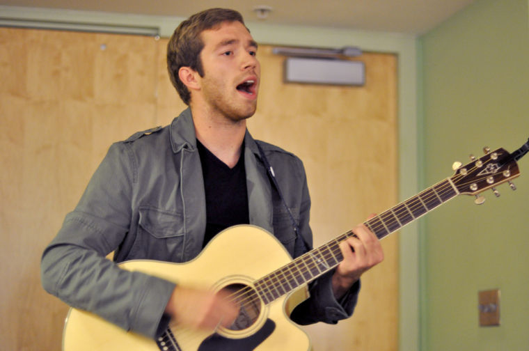 Cory Breth performs his own solo acoustic music live in 2012 at the University for students using a harmonica, piano and guitar.