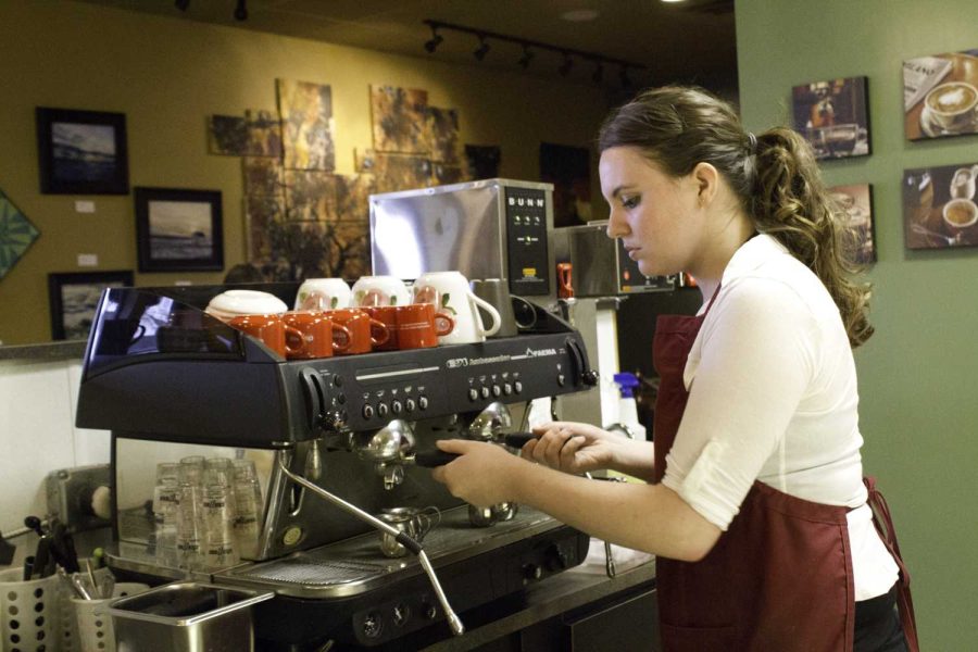 Employee Megan Erhart makes coffee at the European-style Cafe Havana. The cafe is located on South Main Street behind Falcon Food Mart.