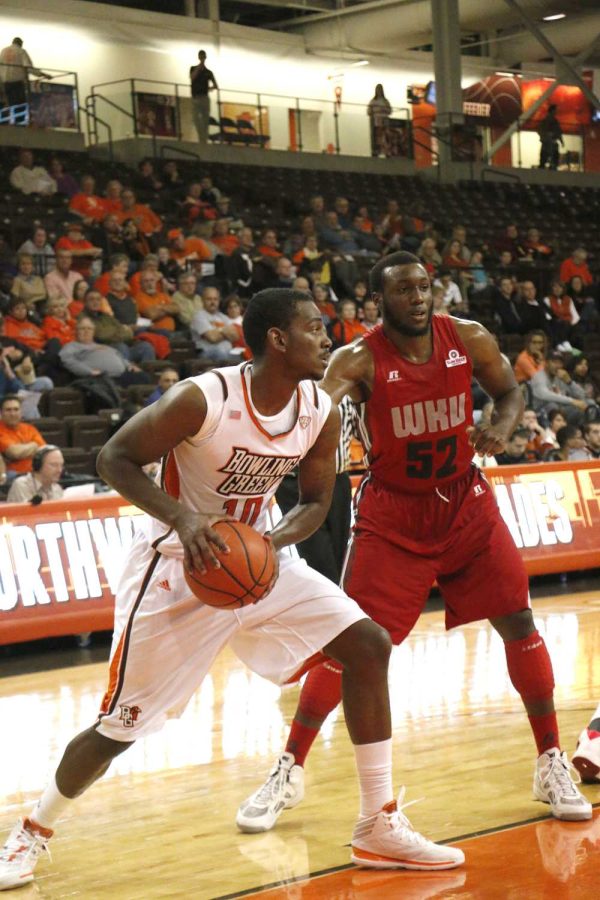 Craig Sealey looks to make a pass against Western Kentucky defender T.J. Price in their 74-62 win on Dec. 2.