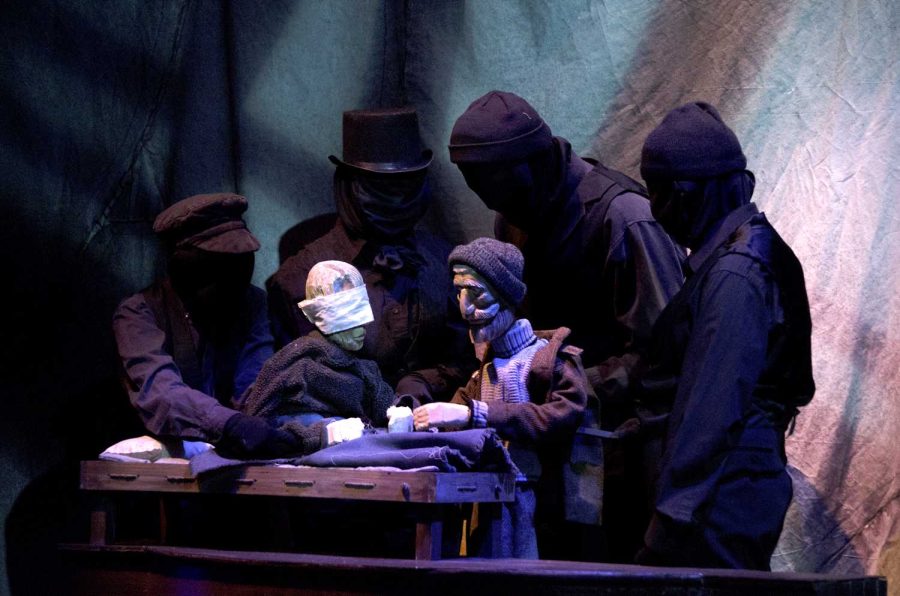 Puppeteers from the puppet show “Frankenstein” control two characters from the play during a rehearsal on Tuesday.