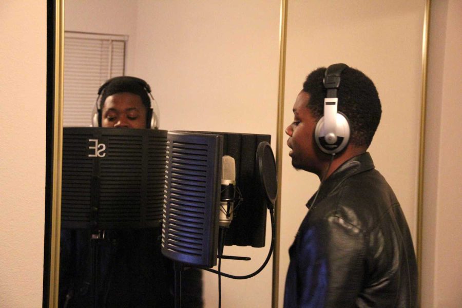 Darius “Byrd The Voice” Byrd, co-founder of Christian hip-hop group The Envy Crew, raps a song in the group’s studio off campus.