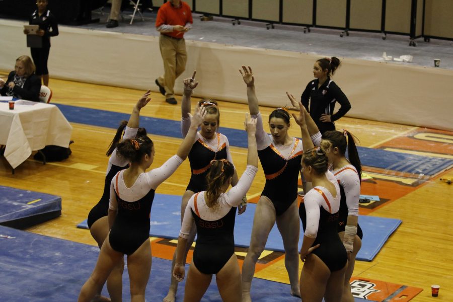 BG Gymnasts come together in a group huddle in a meet earlier this season at Anderson Arena.