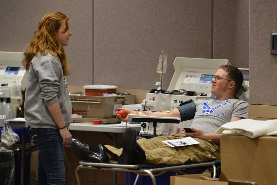 Sophomore Michael Briggs donates a double unit of red blood cells at the Ceasar Chavez Red Cross Blood Drive on Tuesday afternoon.