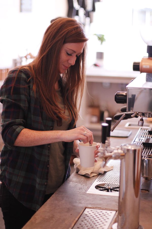A barista prepares a drink at Flatlands Coffee, where customer experience is a top priority.