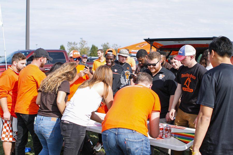 University students enjoy the food, people and environment at a tailgate.