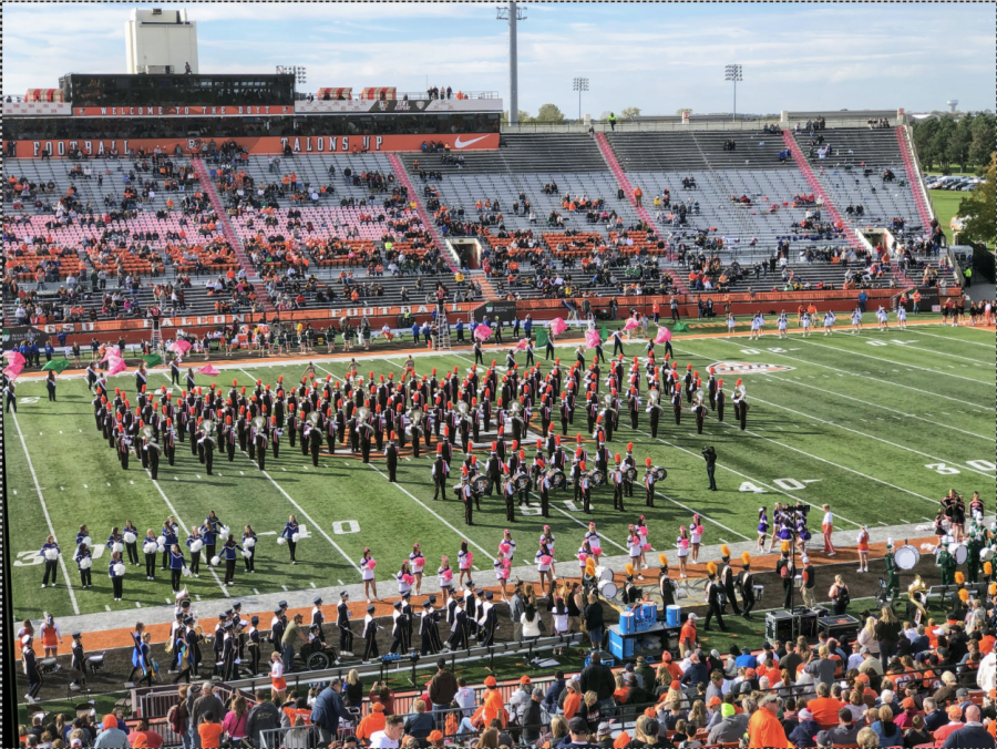 BGSU band playing on the football field at half time. 