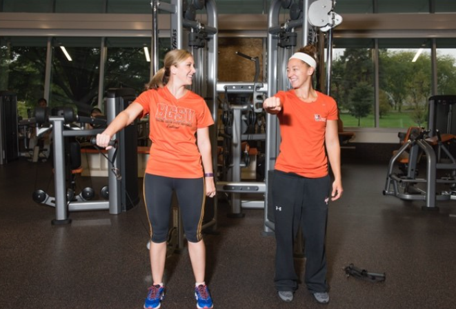 Two students training in the BGSU Student Recreation Center.