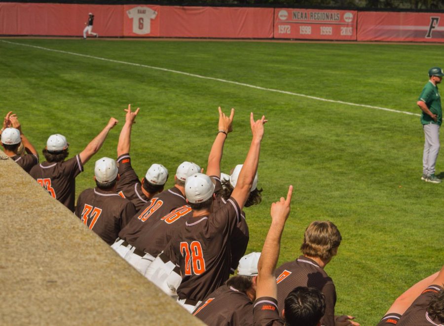 BGSU players celebrating a catch in the outfield for an out.