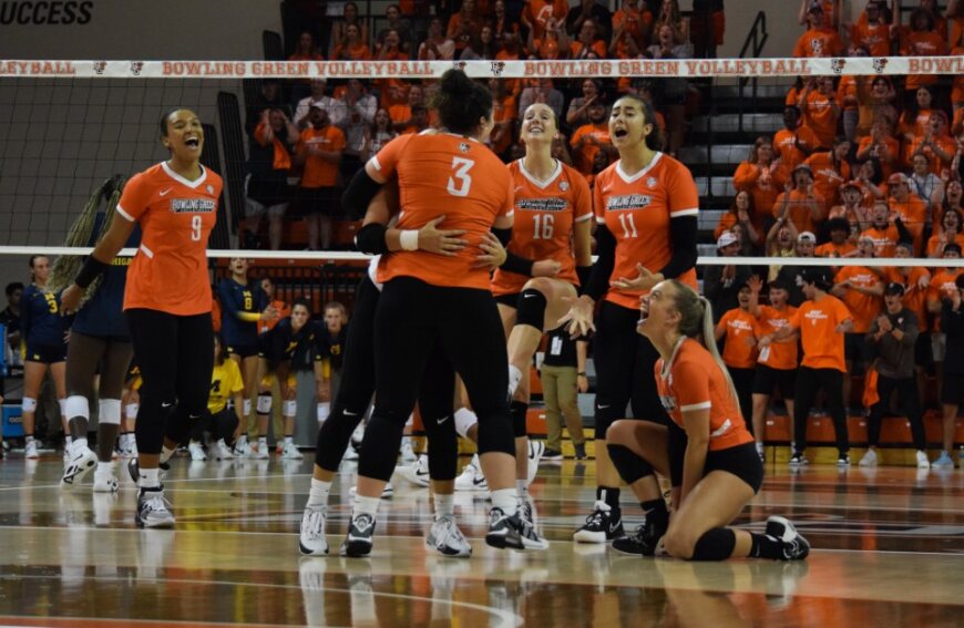BGSU+celebrates+after+Hannah+Best+records+one+of+her+career-high+four+aces+in+the+win+over+Michigan+Friday+night.