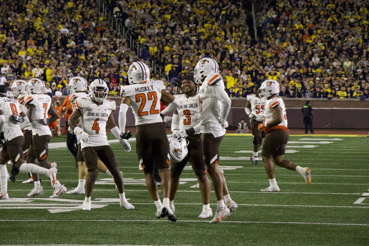 The defense celebrating Jalen Huskey's interception.