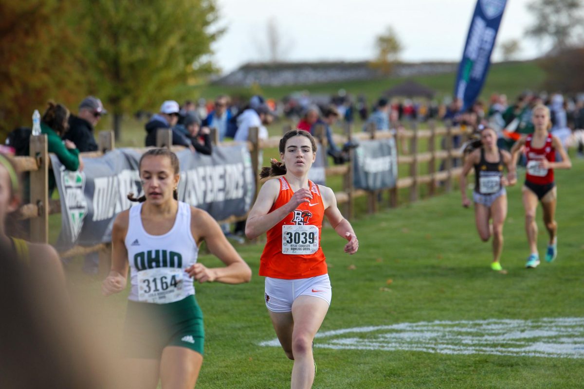 Kylee Cubbison running towards the finish line