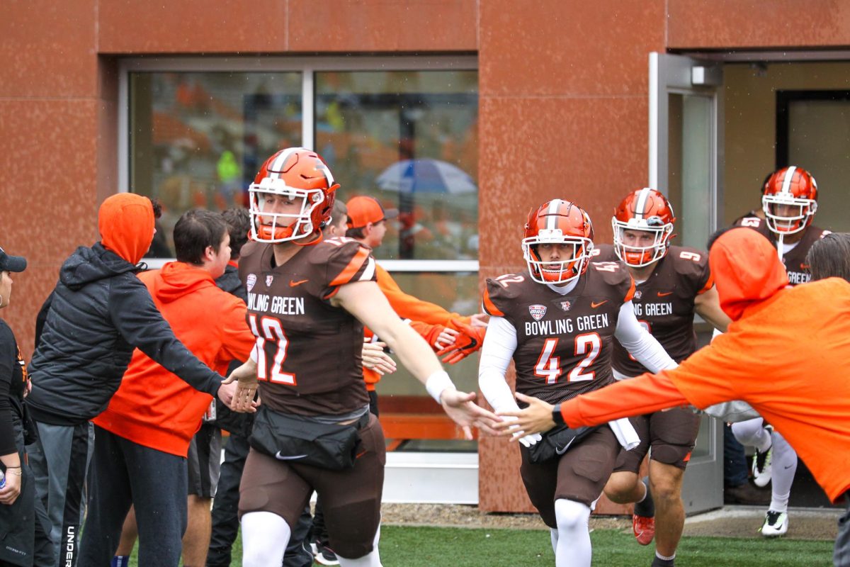 BGSU players running onto the field for the game