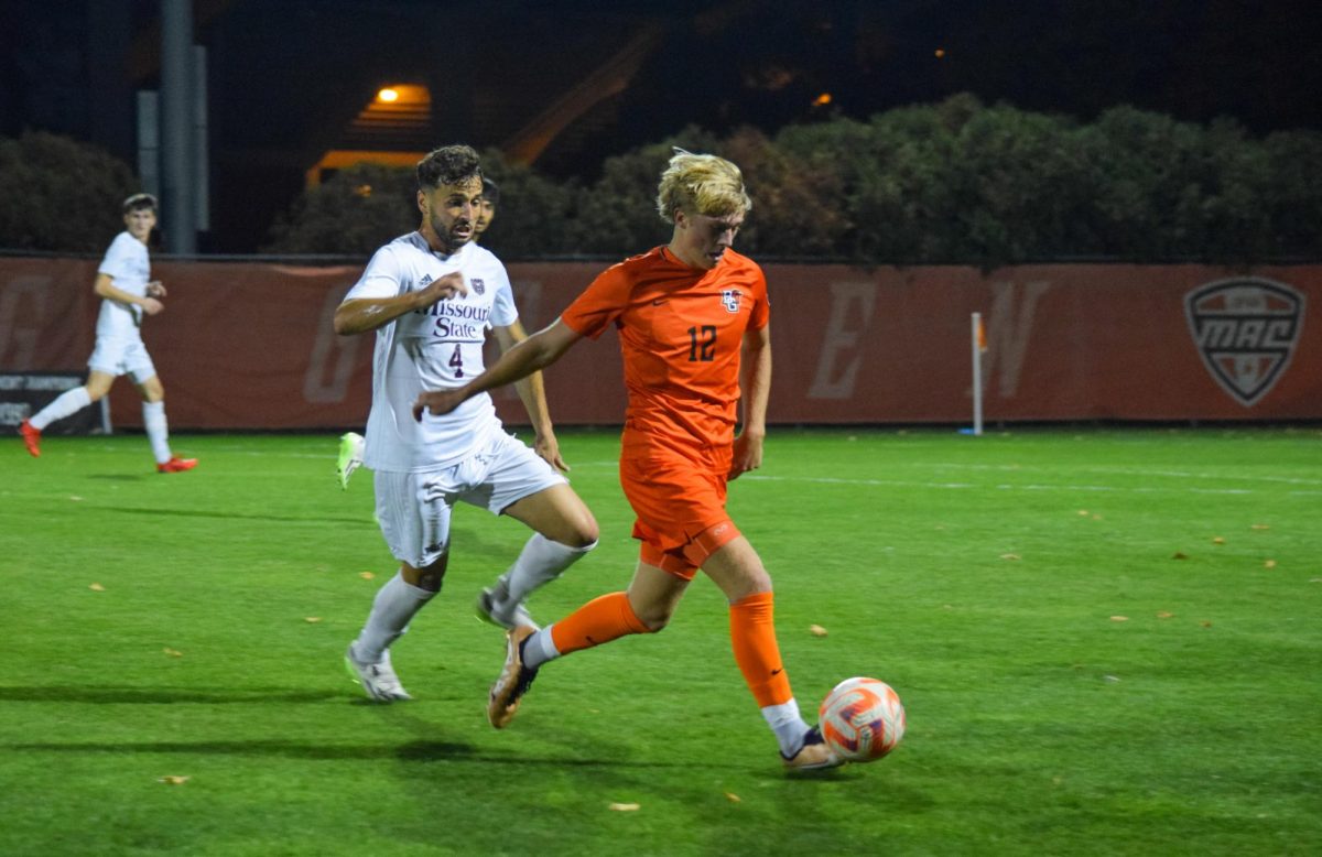 Bennett Painter (#12) running with the ball.