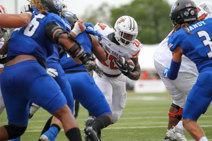 Running back Jaison Patterson runs up the middle against Eastern Illinois