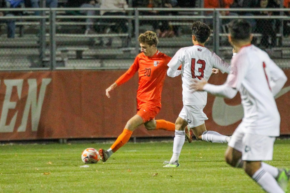 Gus Peacock about to kick the ball towards the net