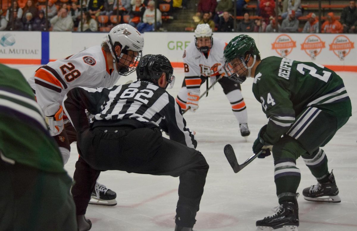 Jaden Grant (#28) taking the faceoff.